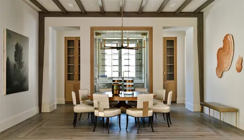 a view of a dining room with furniture and window