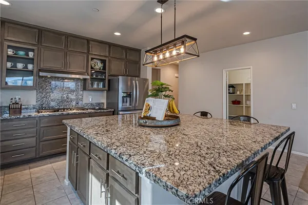 a kitchen with stainless steel appliances granite countertop a sink and cabinets
