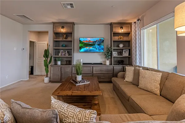 a room that has a bed and a chair in it