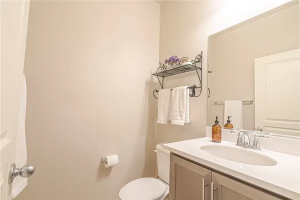 an aerial view of residential houses with outdoor space and pool