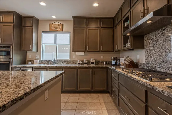 a kitchen with a sink and a refrigerator