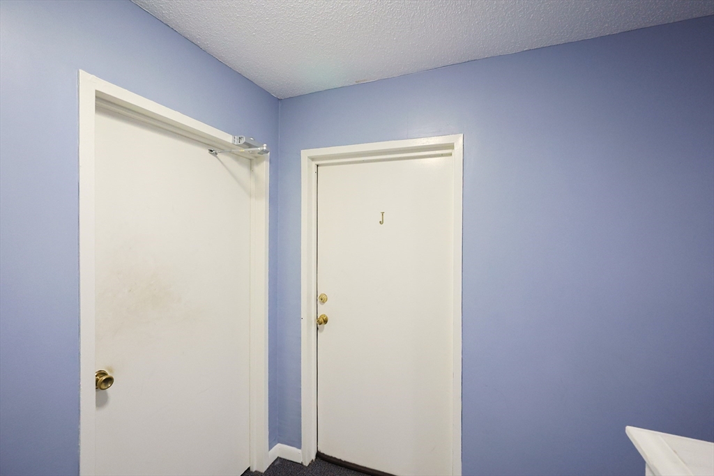 3 Dailey Street, Unit J Attleboro, MA 02703 - Photo 19 of 24 a view of closet area