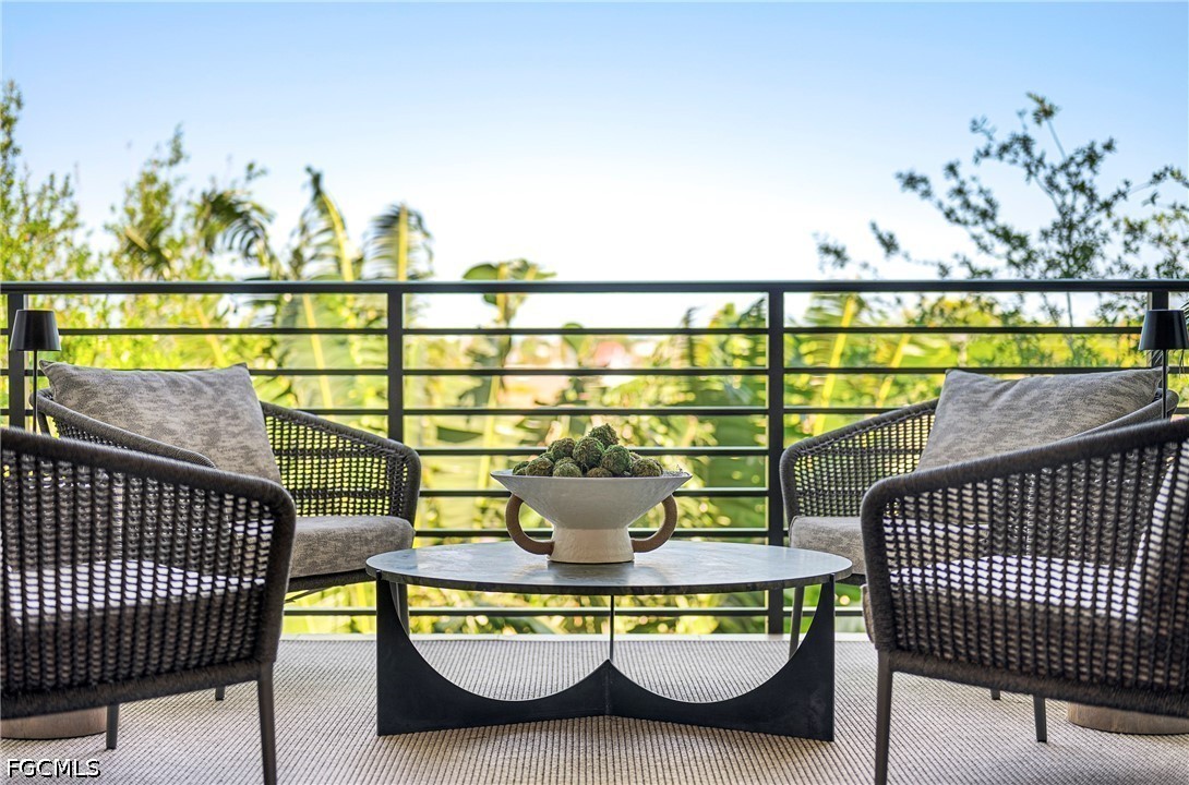 1115 Central Avenue, Unit 443 Naples, FL 34102 - Photo 31 of 40 a view of a swimming pool and outdoor seating