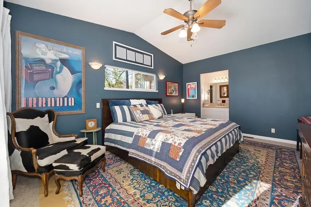 a bedroom with furniture and a window