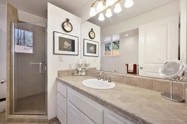 a bathroom with a sink and a mirror