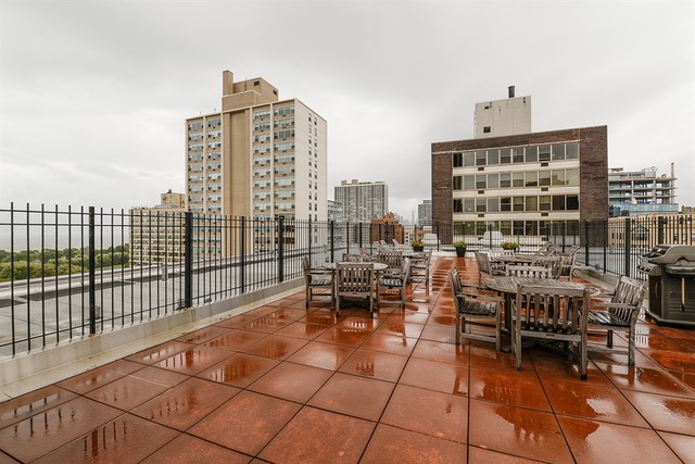 3033 North Sheridan Road, Unit 701 Chicago, IL 60657 - Photo 11 of 13 a view of city from balcony with seating space