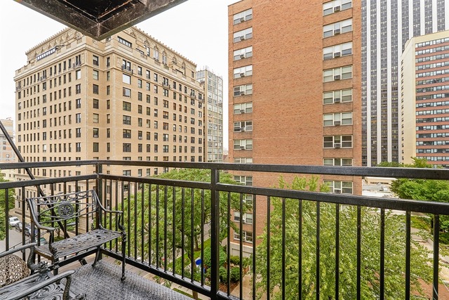 3033 North Sheridan Road, Unit 701 Chicago, IL 60657 - Photo 10 of 13 a view of a balcony with a floor to ceiling window