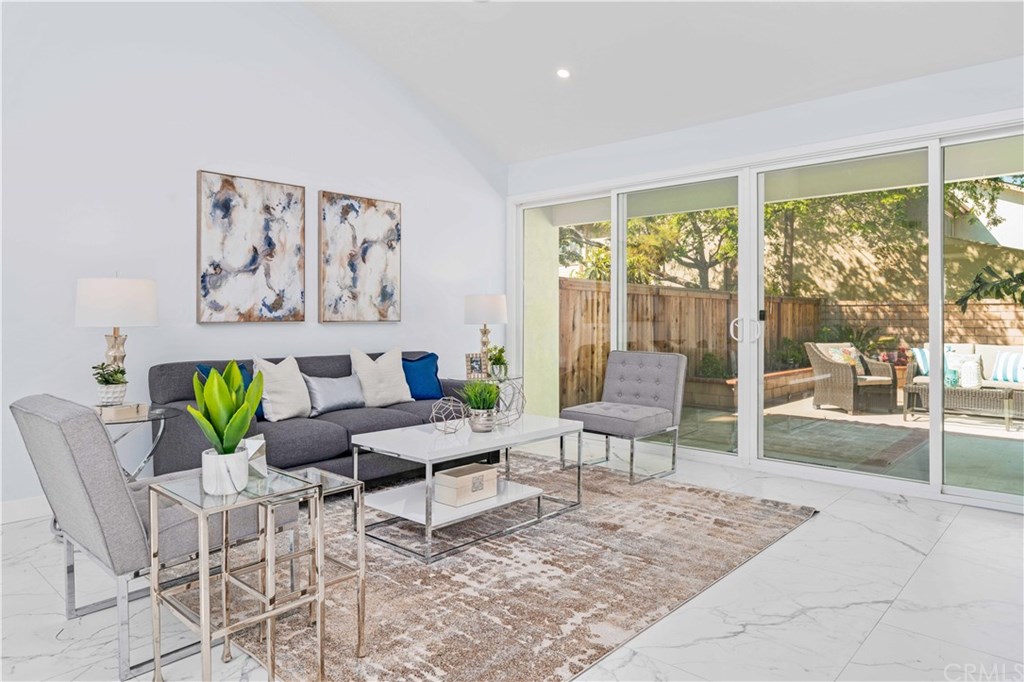 16 FOOT SLIDING DOORS CONNECT YOUR LIVING ROOM TO THE SPACIOUS YARD CREATING AN ENTERTAINERS' OASIS!