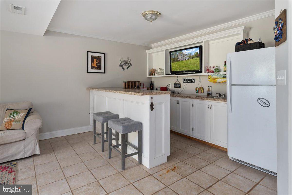 840 West Mount Harmony Road Owings, MD 20736 - Photo 24 of 38 Basement with wet-bar
