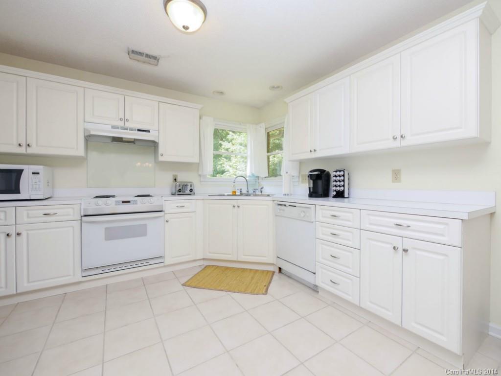 708 Monticello Drive Fort Mill, SC 29708 - Photo 12 of 22 a kitchen with cabinets stainless steel appliances and a sink