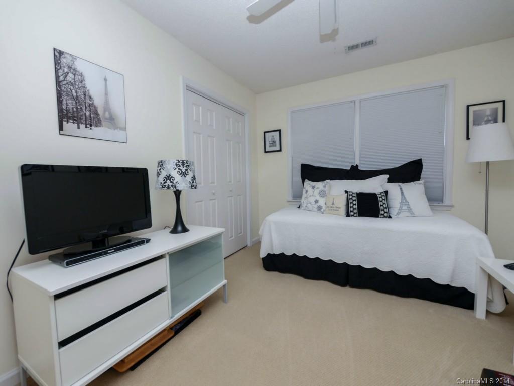 708 Monticello Drive Fort Mill, SC 29708 - Photo 15 of 22 a bedroom with a bed and flat screen tv