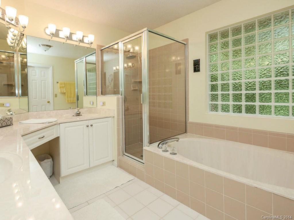 708 Monticello Drive Fort Mill, SC 29708 - Photo 16 of 22 a bathroom with a bathtub sink and mirror