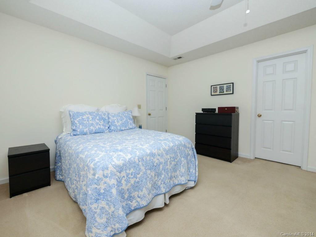 708 Monticello Drive Fort Mill, SC 29708 - Photo 17 of 22 a bedroom with a bed and cabinet