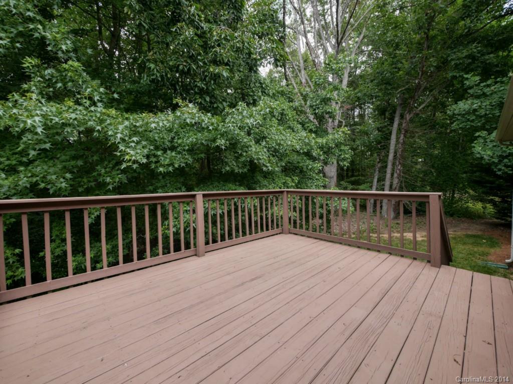 708 Monticello Drive Fort Mill, SC 29708 - Photo 18 of 22 a balcony with wooden floor and trees in the background