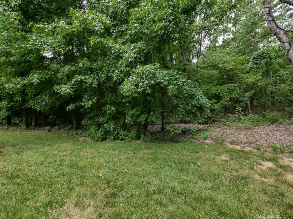 708 Monticello Drive Fort Mill, SC 29708 - Photo 20 of 22 a view of a grassy field with trees in the background