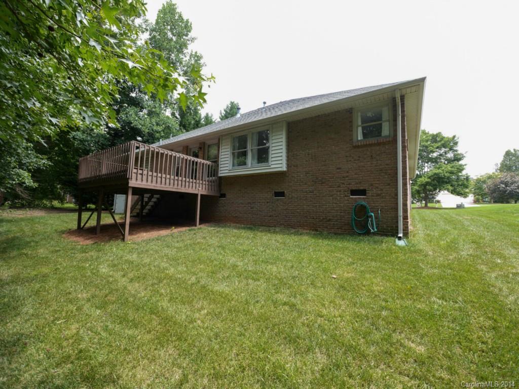 708 Monticello Drive Fort Mill, SC 29708 - Photo 21 of 22 a view of a house with a backyard and wooden deck