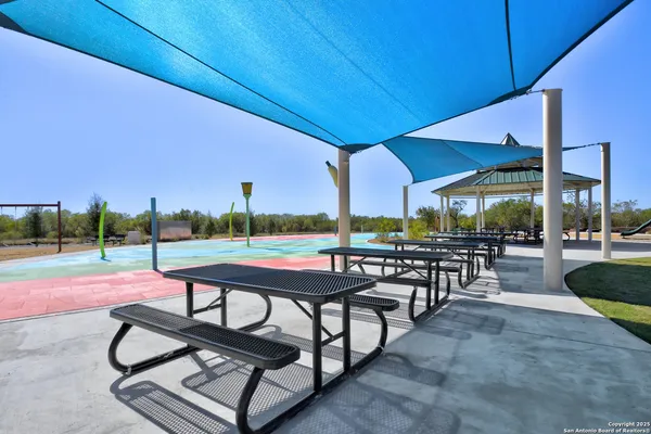 a view of a backyard with sitting area