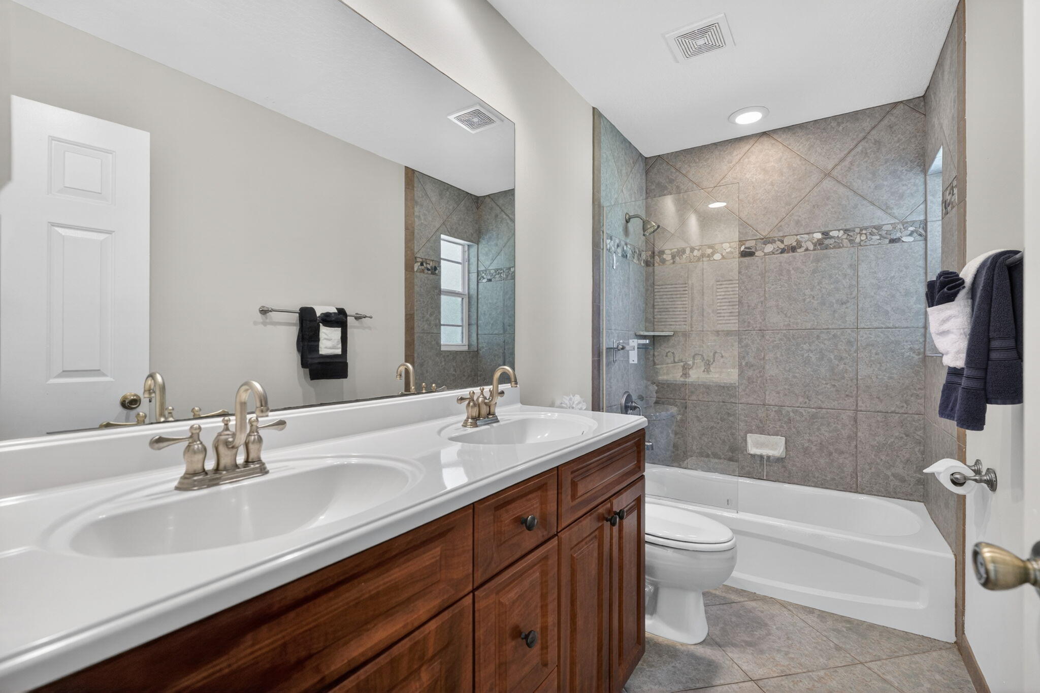 5741 Southeast Winged Foot Drive Stuart, FL 34997 - Photo 25 of 58 Guest Bathroom