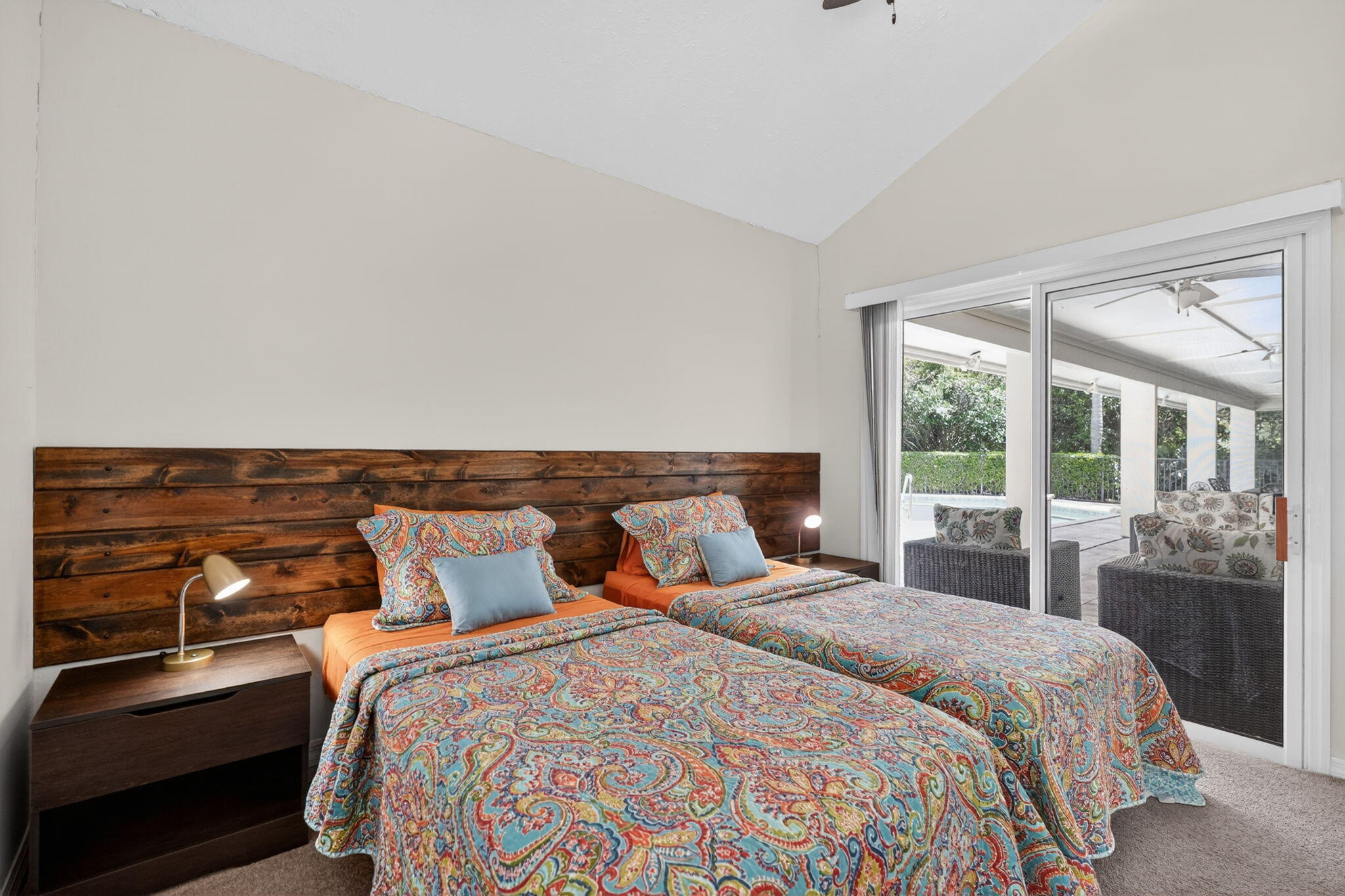5741 Southeast Winged Foot Drive Stuart, FL 34997 - Photo 26 of 58 a bedroom with a bed and wooden floor