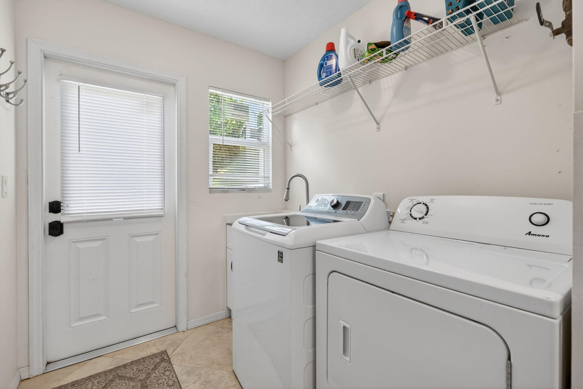 5741 Southeast Winged Foot Drive Stuart, FL 34997 - Photo 30 of 58 a utility room with dryer and washer