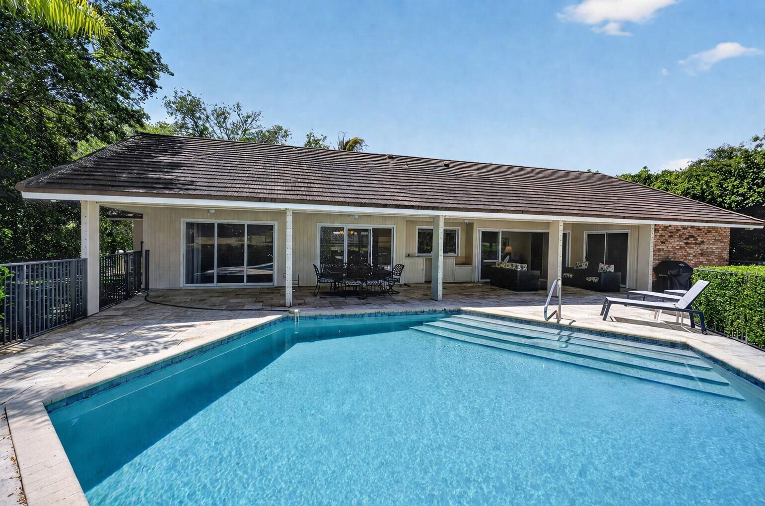 5741 Southeast Winged Foot Drive Stuart, FL 34997 - Photo 41 of 58 a house view with a garden space