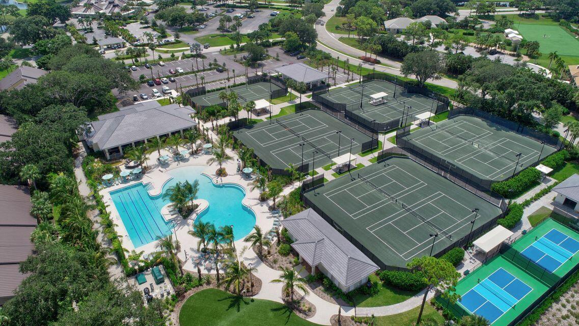 5741 Southeast Winged Foot Drive Stuart, FL 34997 - Photo 50 of 58 an aerial view of a house