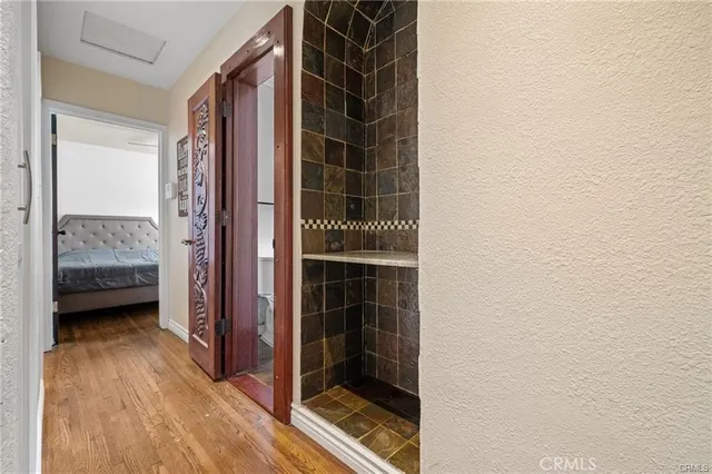 a view of hallway with wooden floor