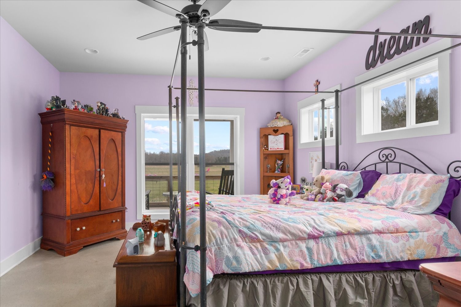 2526 Endsley Rankin Road Lewisburg, TN 37091 - Photo 22 of 49 a bedroom with a large bed and a chandelier