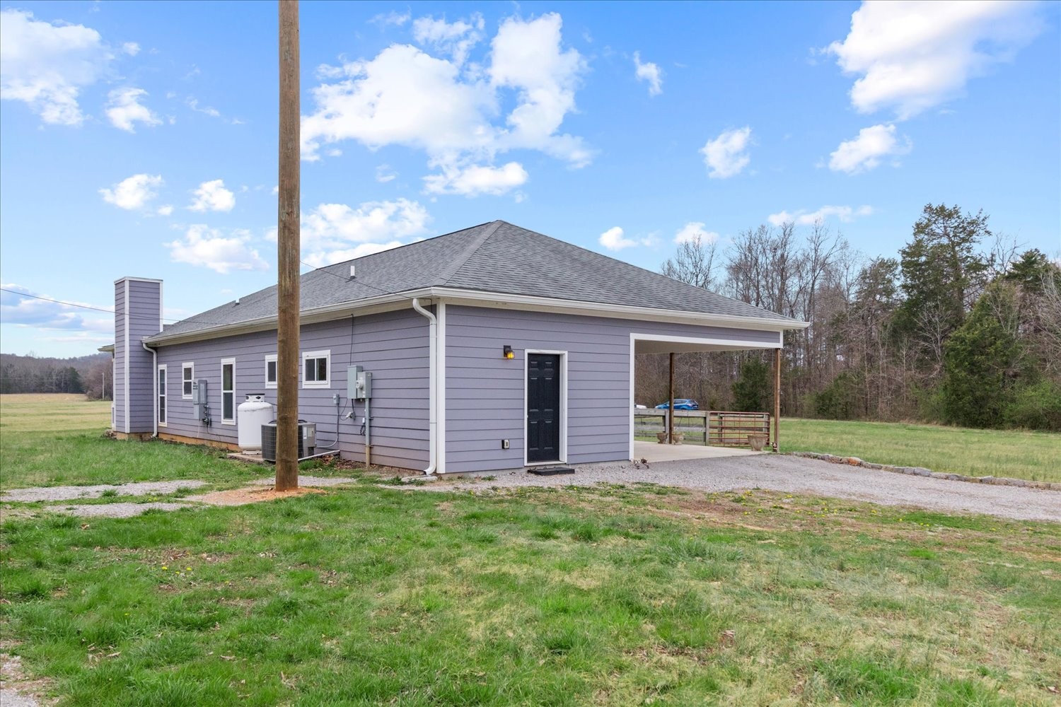 2526 Endsley Rankin Road Lewisburg, TN 37091 - Photo 31 of 49 a backyard of a house with wooden fence and a large tree