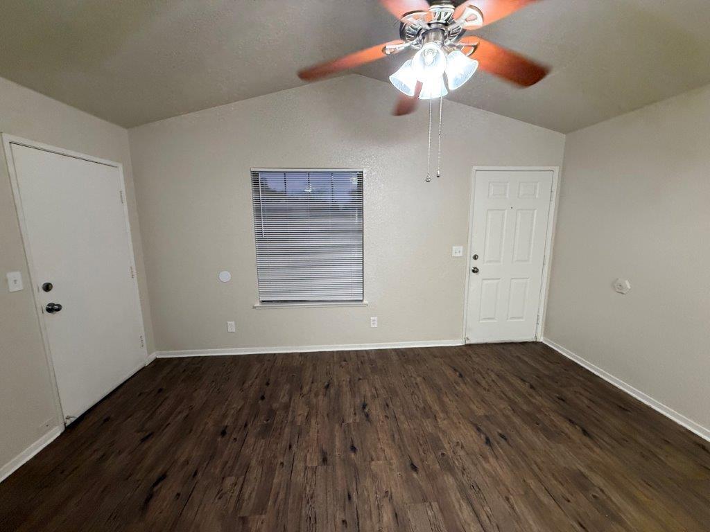 1405 East Cypress Avenue Reedley, CA 93654 - Photo 16 of 29 wooden floor in an empty room with a window