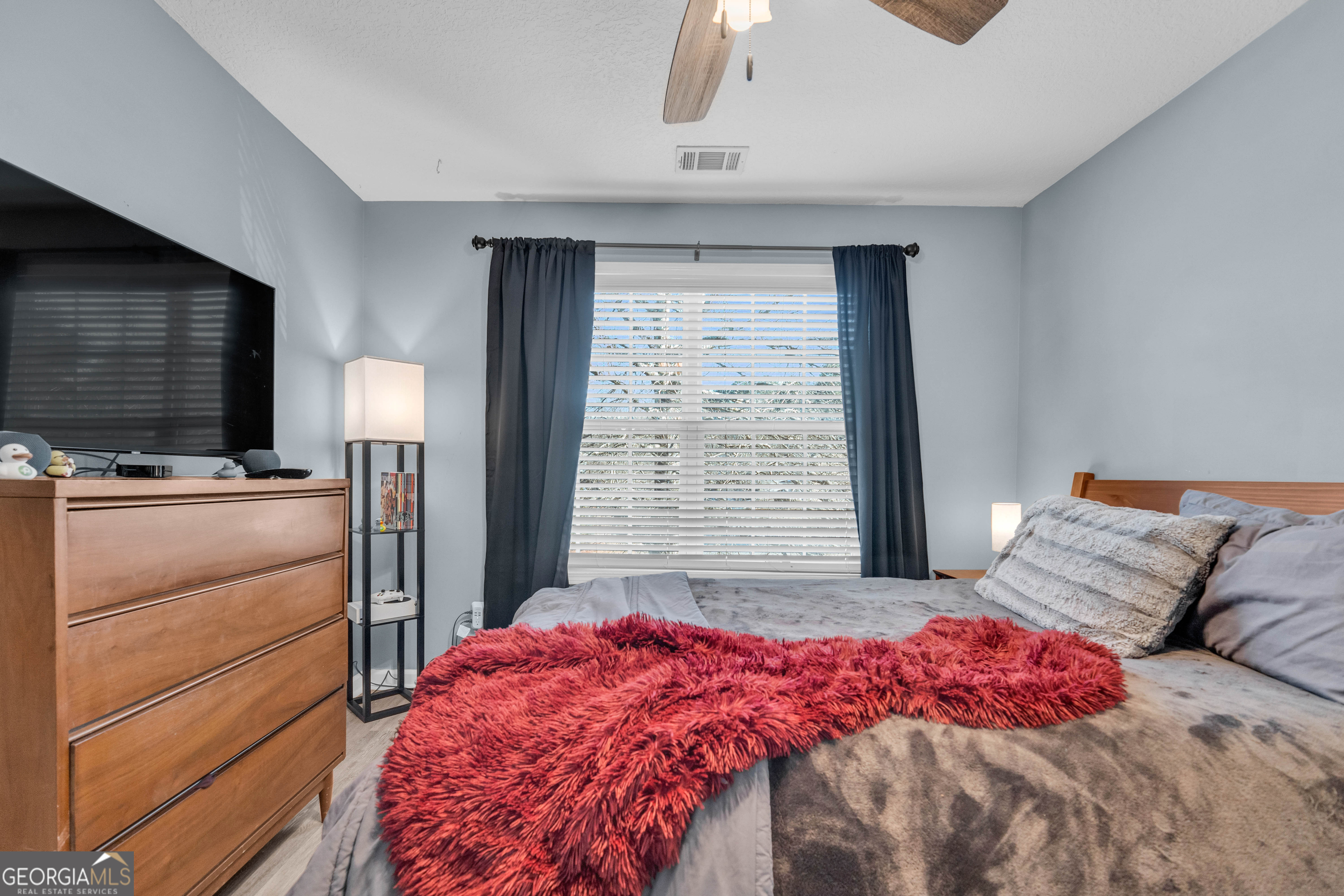 748 West Vincent Drive Athens, GA 30607 - Photo 12 of 18 a bedroom with a bed and a flat screen tv