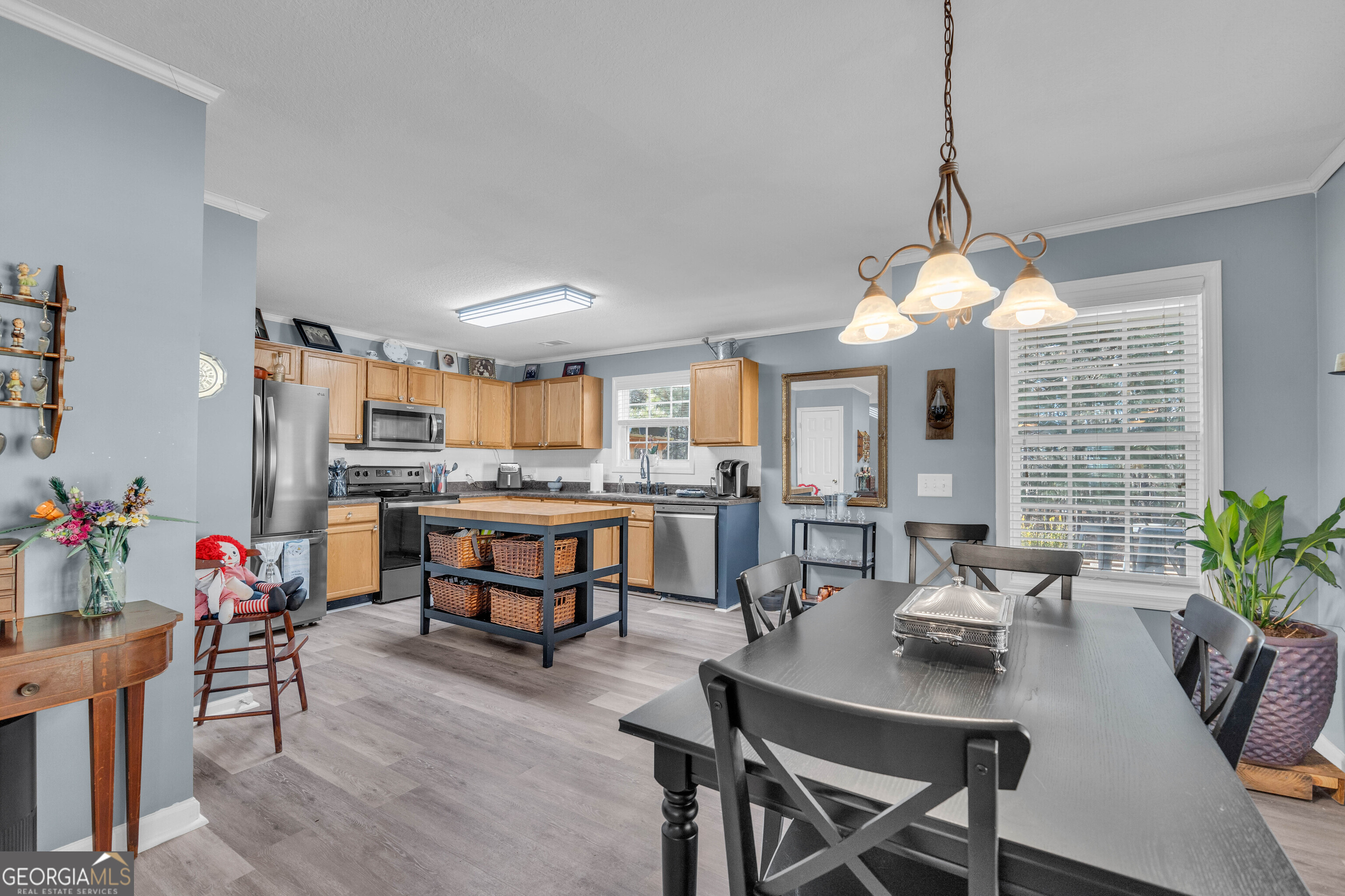748 West Vincent Drive Athens, GA 30607 - Photo 7 of 18 a view of a dining room with furniture and a chandelier