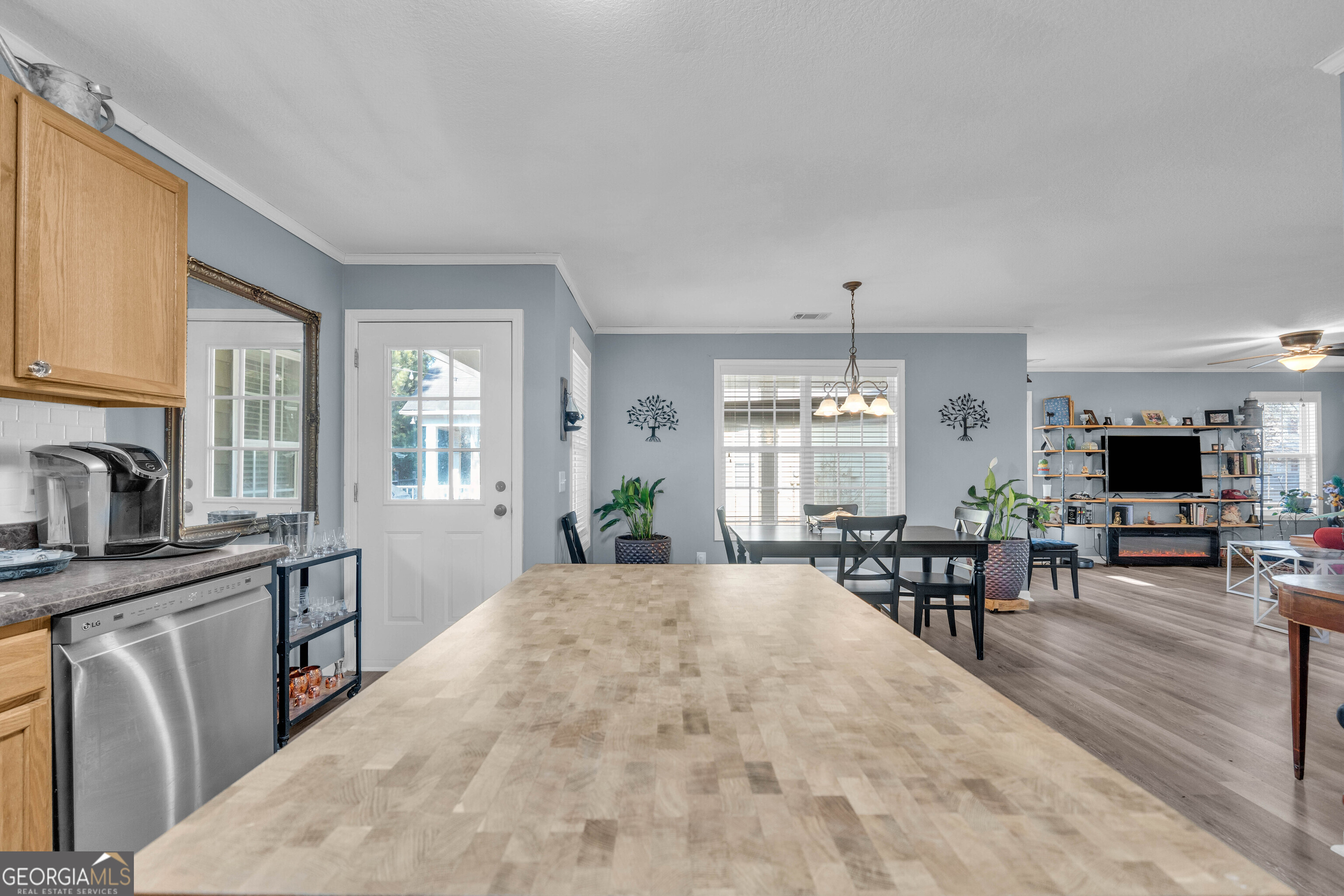 748 West Vincent Drive Athens, GA 30607 - Photo 9 of 18 a living room with furniture a flat screen tv and a large window