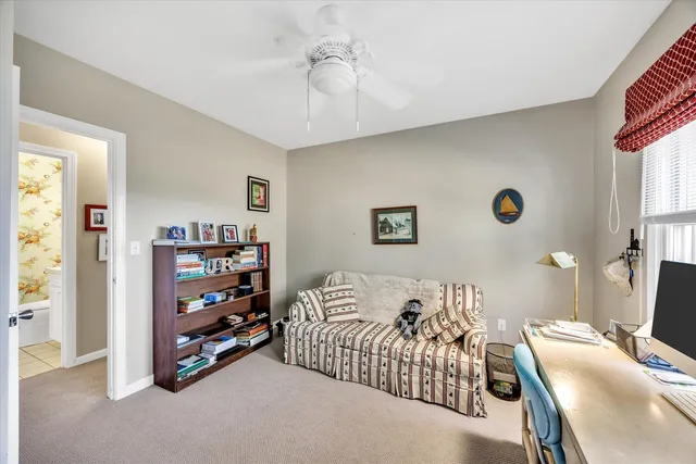 a bedroom with bed and a window