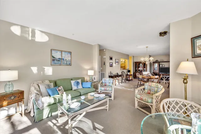 a view of a livingroom with furniture and a wooden floor