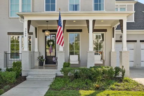 a front view of a house with a porch