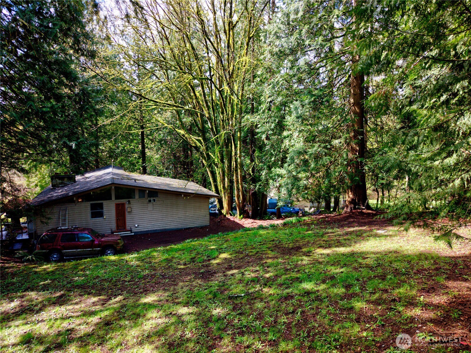 26910 Northeast Kennedy Drive Duvall, WA 98019 - Photo 4 of 24 a front view of a house with garden