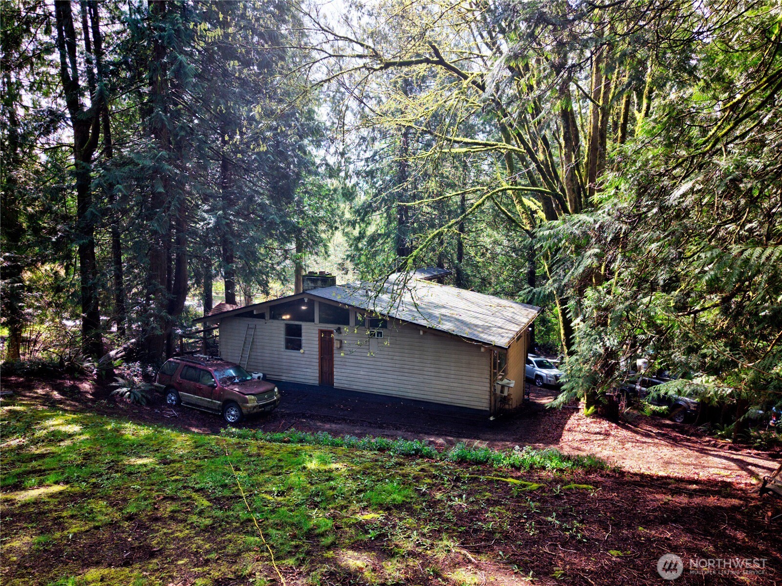 26910 Northeast Kennedy Drive Duvall, WA 98019 - Photo 5 of 24 a view of a backyard with sitting area