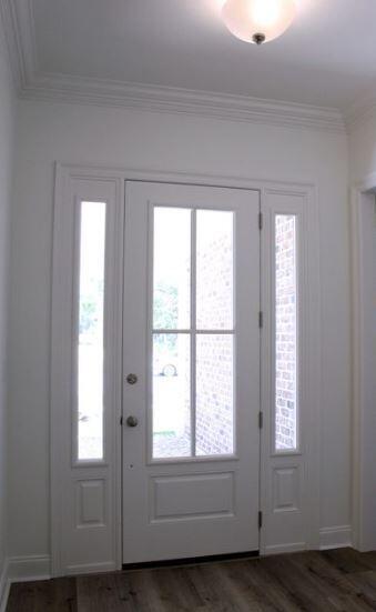 1144 Deer Moss Loop Niceville, FL 32578 - Photo 3 of 11 an empty room with wooden floor and windows