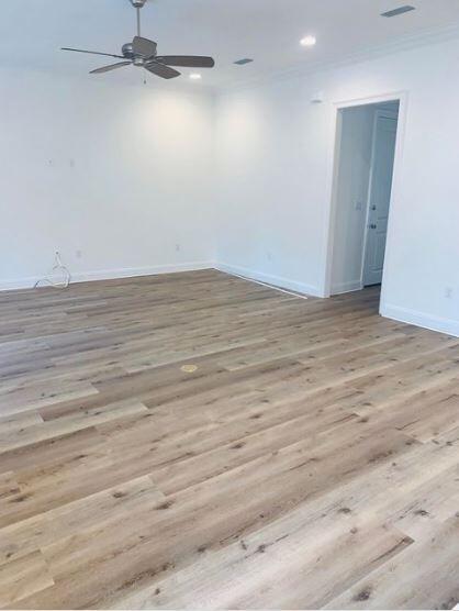 1144 Deer Moss Loop Niceville, FL 32578 - Photo 5 of 11 an empty room with wooden floor and windows