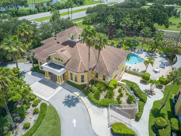 an aerial view of a house with a yard and garden