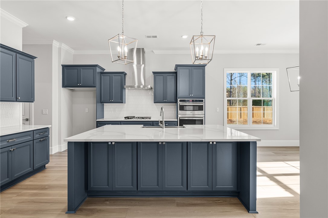 141 Rickys Path Easley, SC 29642 - Photo 10 of 40 This kitchen showcases a central island and contemporary appliances, ideal for culinary exploration.