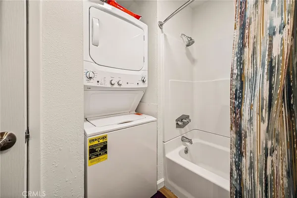 a bathroom with a bathtub and shower