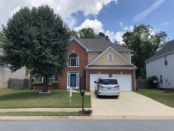 a car parked in front of a house