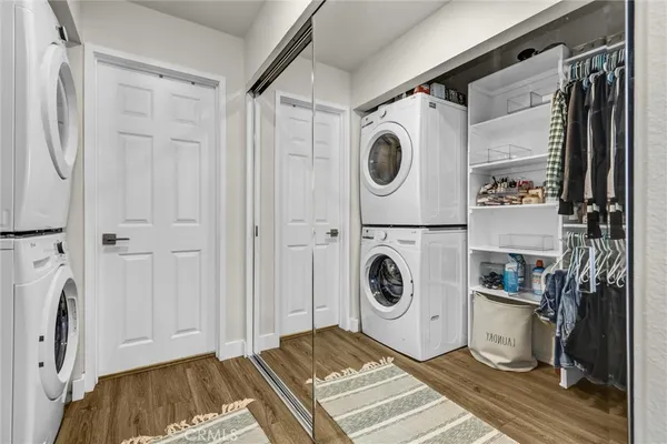 a view of a storage & utility room with a washer dryer