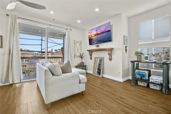 a living room with fireplace furniture and a flat screen tv
