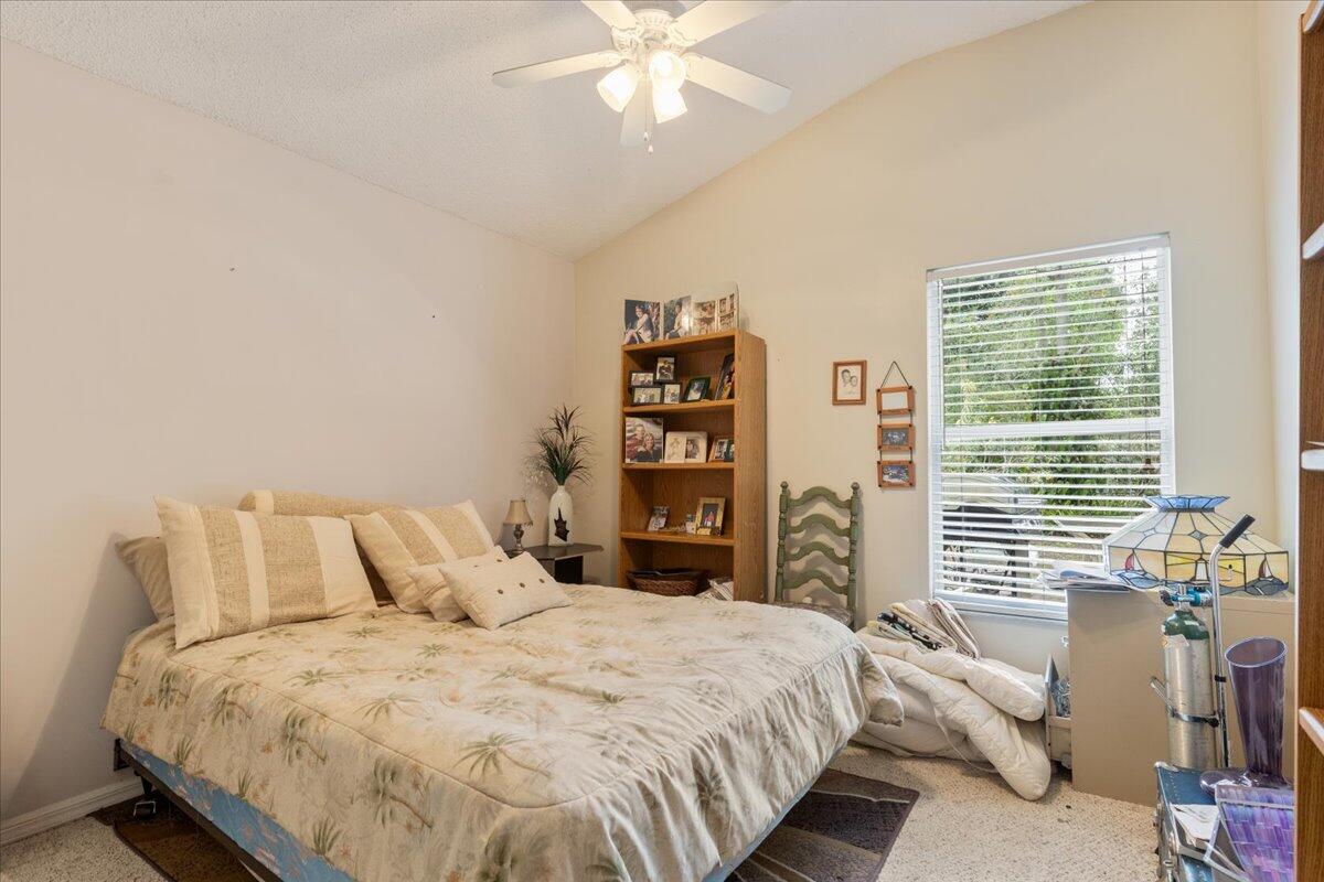 8006 Eden Road Fort Pierce, FL 34951 - Photo 14 of 25 a bedroom with a bed and a large window