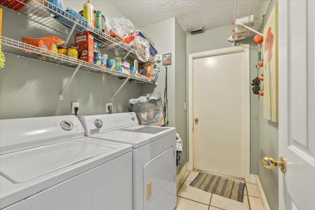 8006 Eden Road Fort Pierce, FL 34951 - Photo 15 of 25 a utility room with dryer and washer