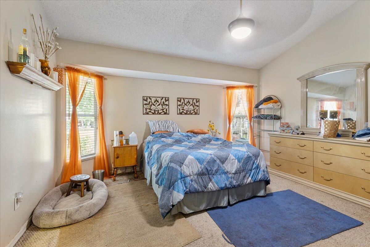 8006 Eden Road Fort Pierce, FL 34951 - Photo 16 of 25 a spacious bedroom with a bed and window