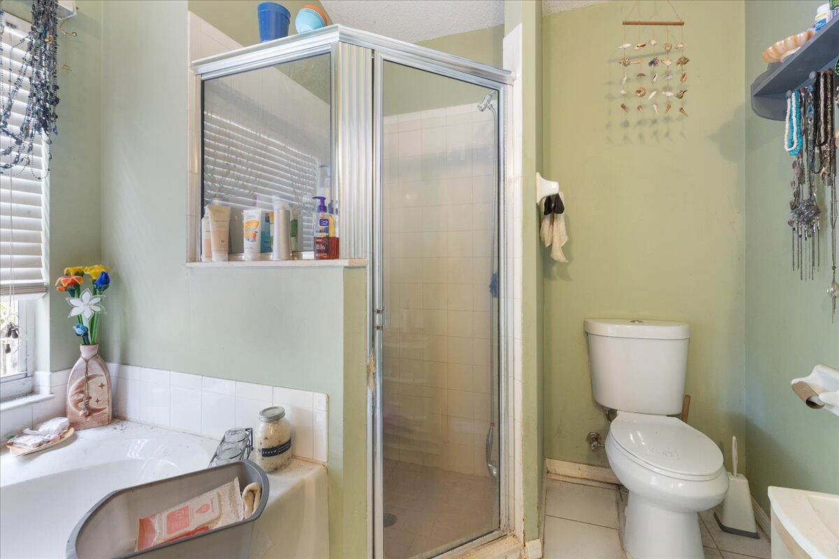 8006 Eden Road Fort Pierce, FL 34951 - Photo 20 of 25 a bathroom with a toilet and a shower